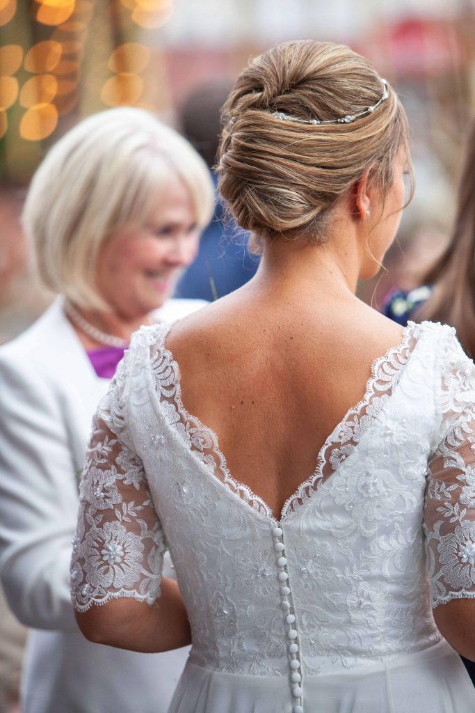 detail shot of back of brides dress