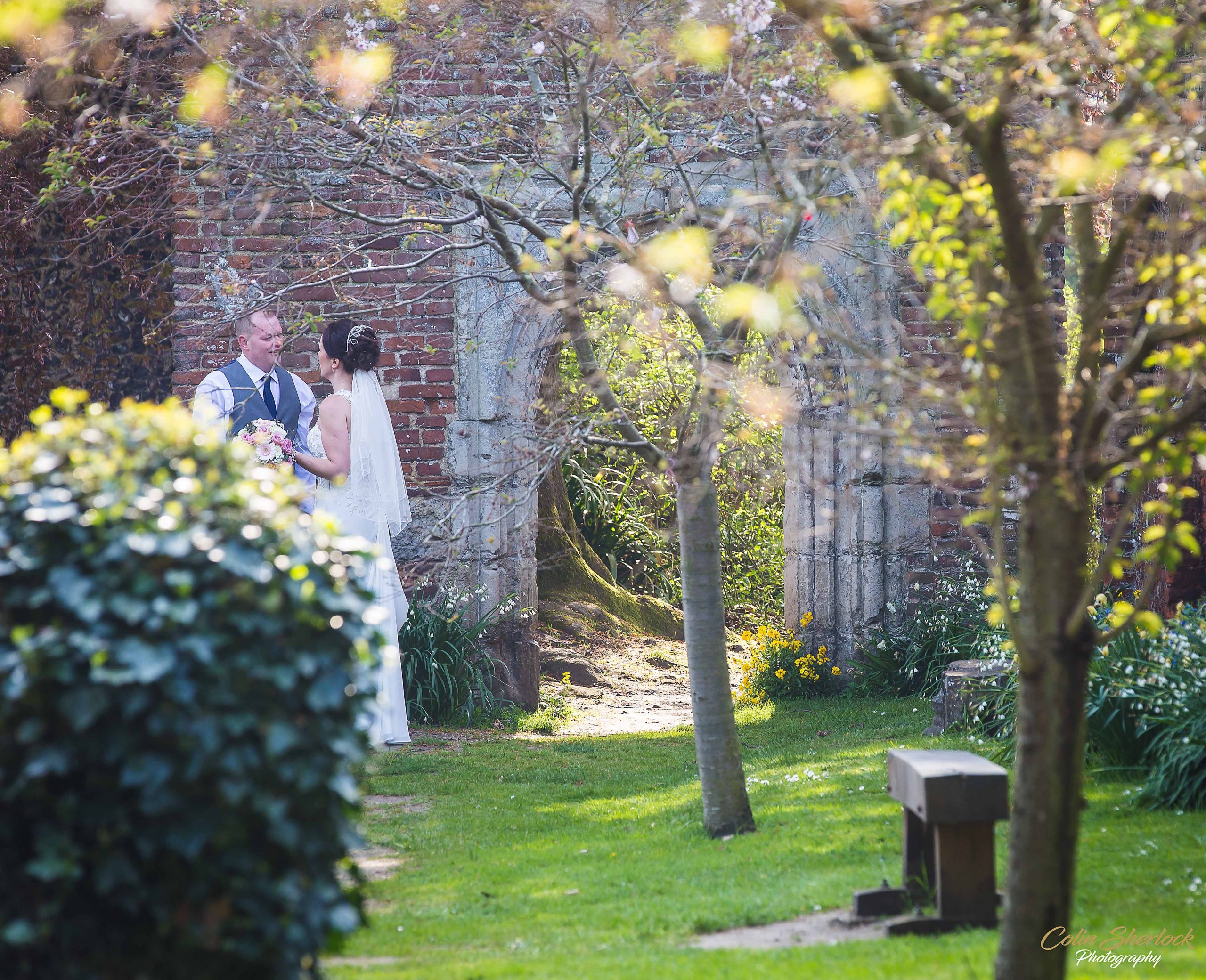 bride and groom in Greyfriars gardens in Canterbury