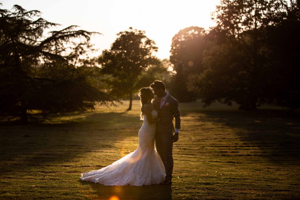 wedding portrait at sunset in swarling manor gardens