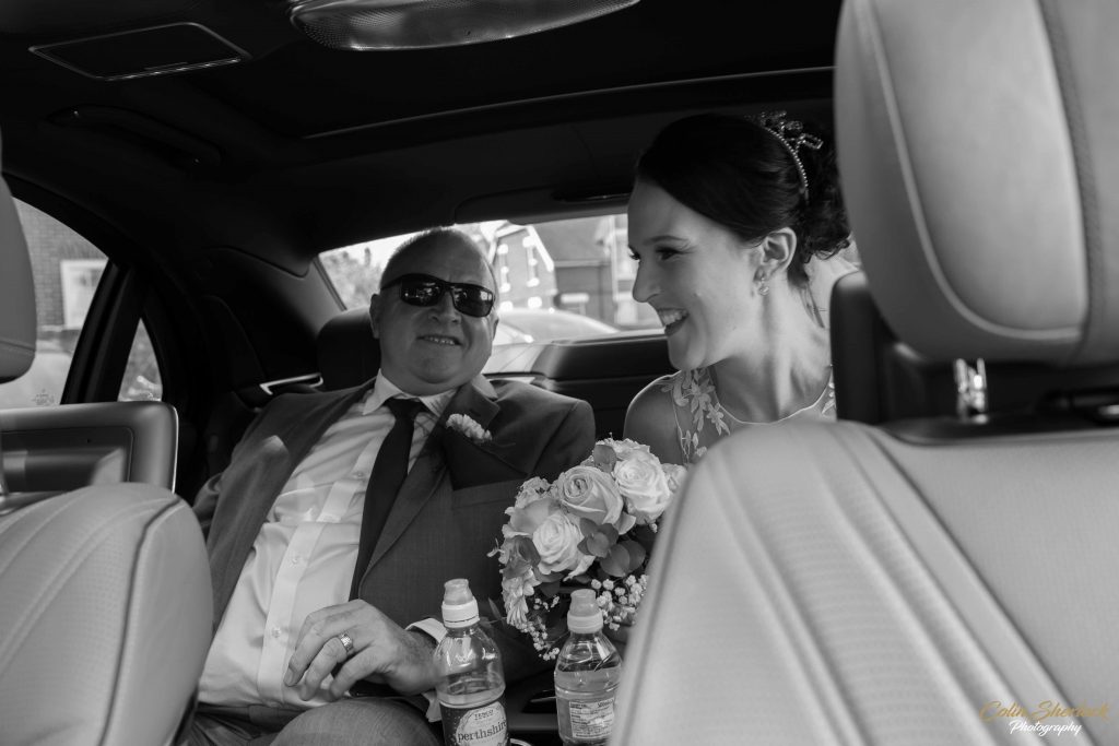 father and daughter in wedding car