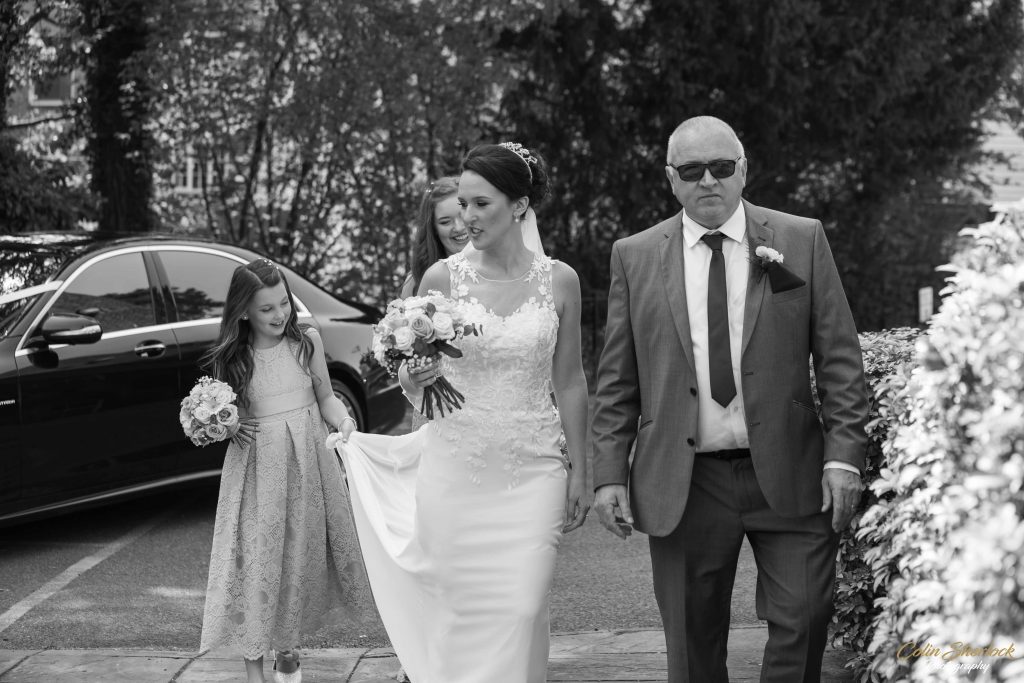 father, daughter and bridesmaids