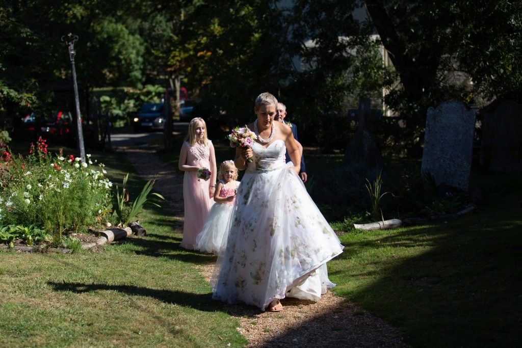 bride with bridesmaids walking