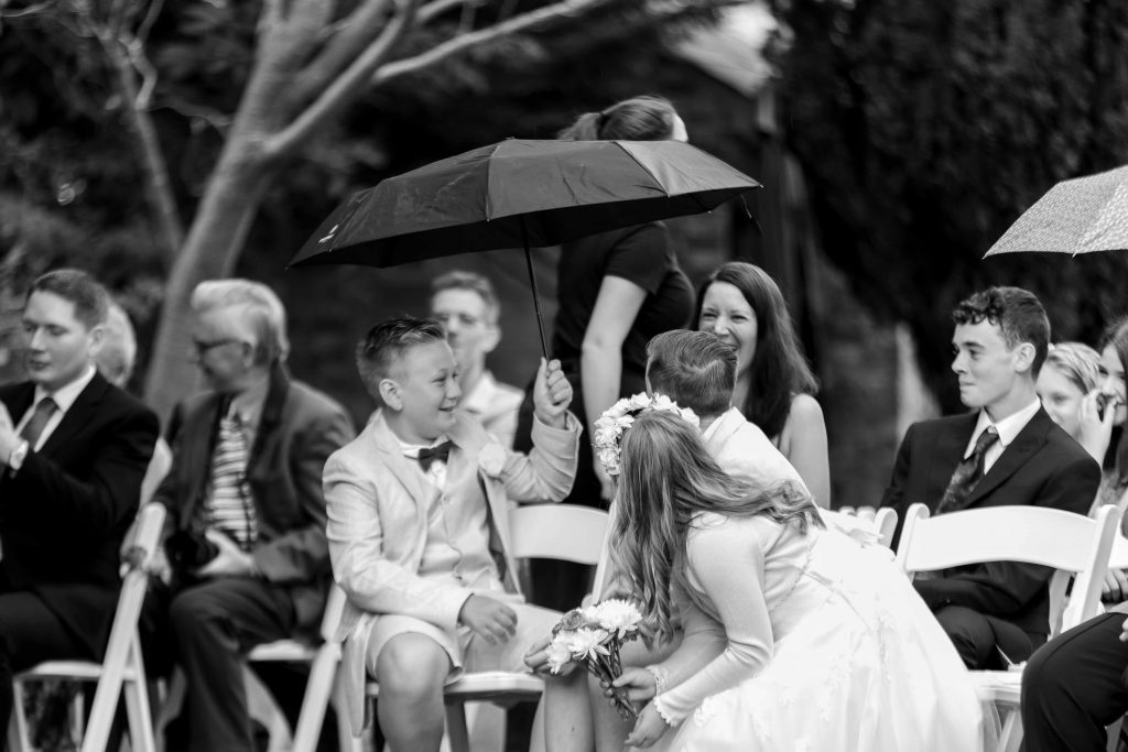umbrellas at outside wedding ceremony