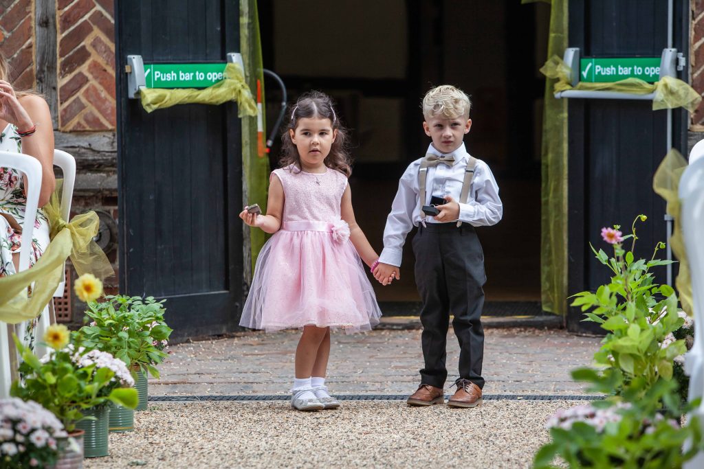 boy and girl as ring bearers at wedding