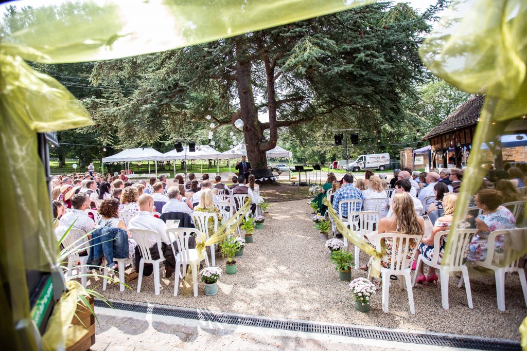guests seated outside at Chilham village hall wedding