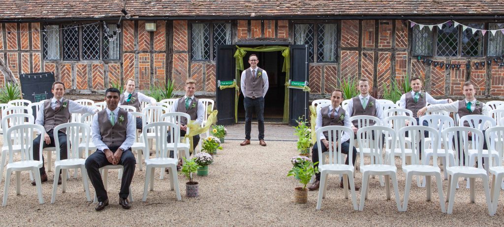 groomsmen posing with groom at Chilham village hall