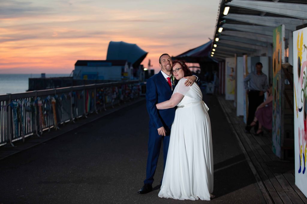 bride and groom flash portrait on herne bay pier