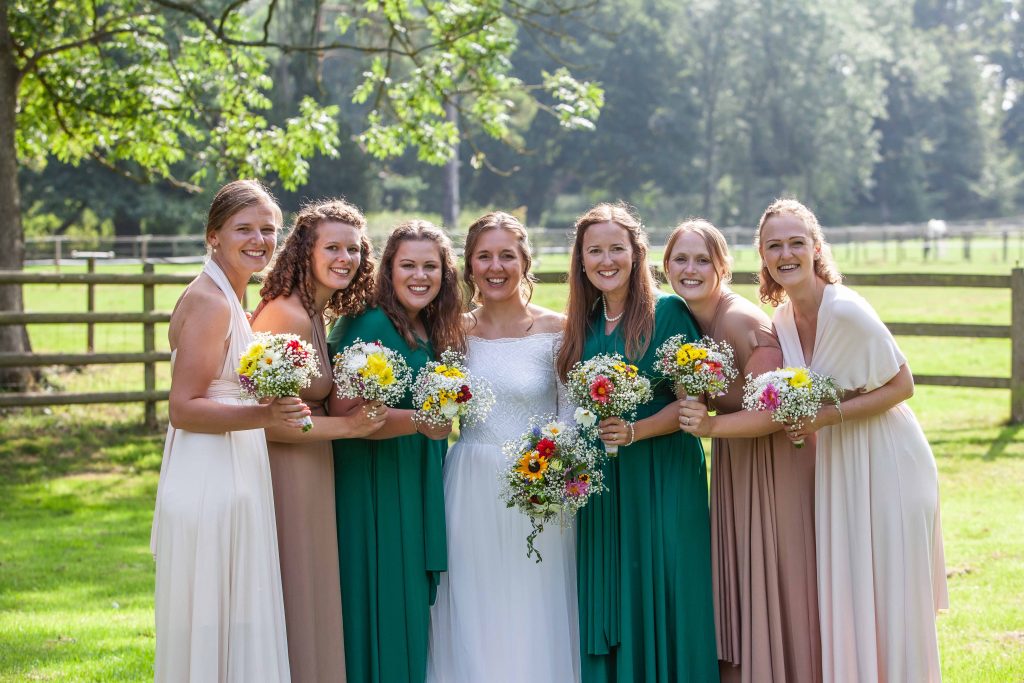 bride with bridesmaids at Chilham village hall