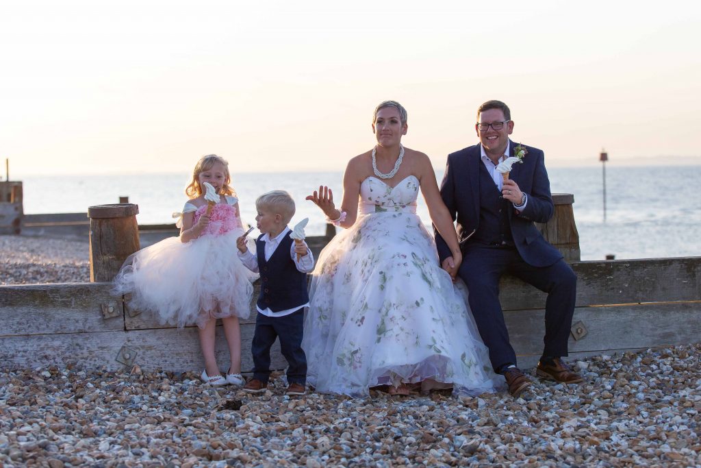 informal wedding family portrait on beach