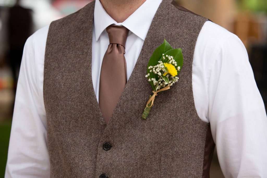 button hole flower on groom