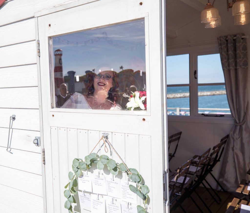 bride in beach hut wedding venue