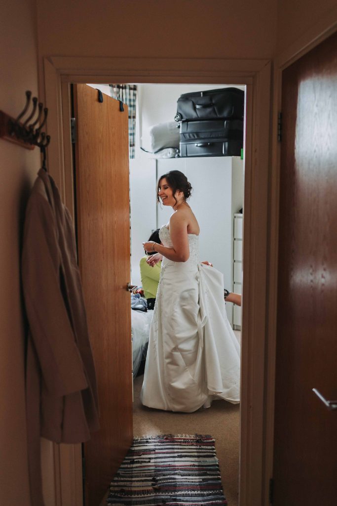 bride in dress in doorway