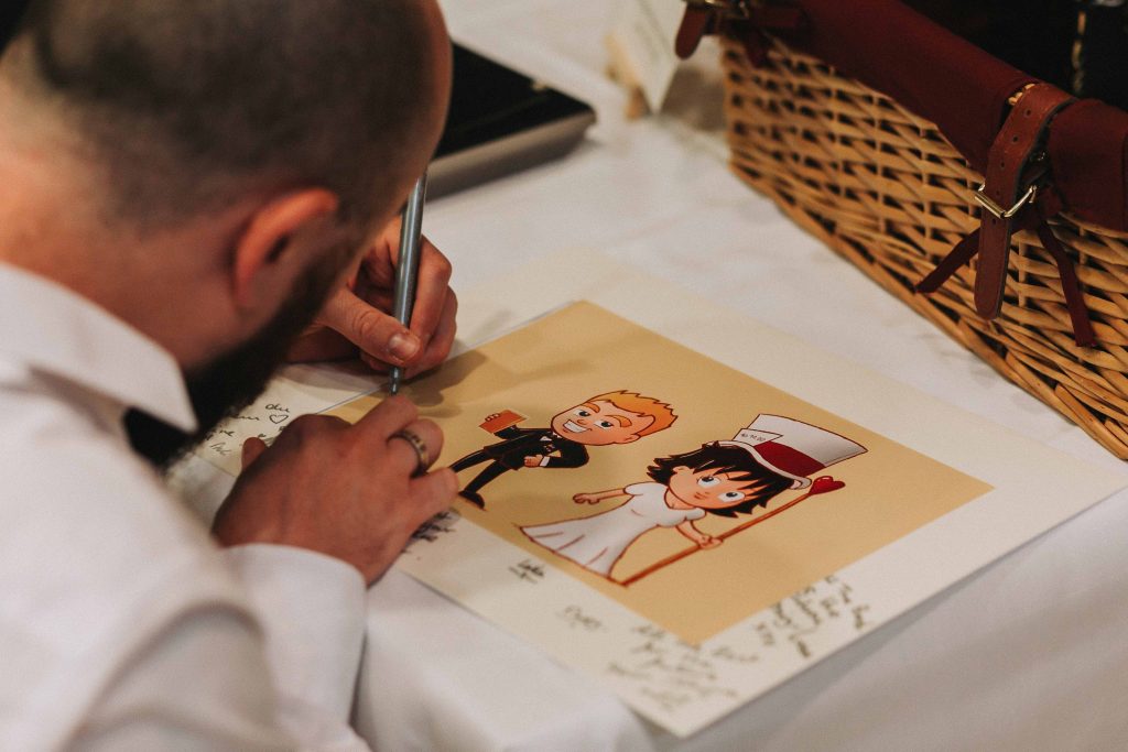 guest signing picture and frame at Canterbury Cathedral lodge wedding