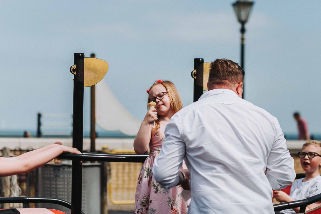 girl admiring her ice cream on a family pre wedding shoot