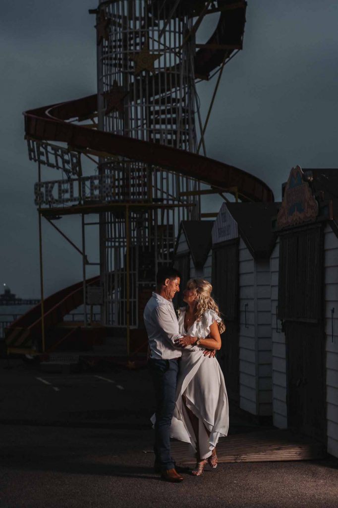 bride and groom portrait at beach hut weddings on Herne Bay pier