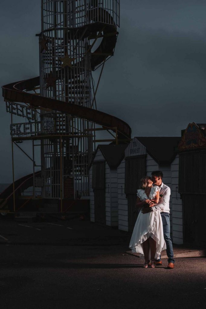 bride and groom portrait at beach hut weddings on Herne Bay pier