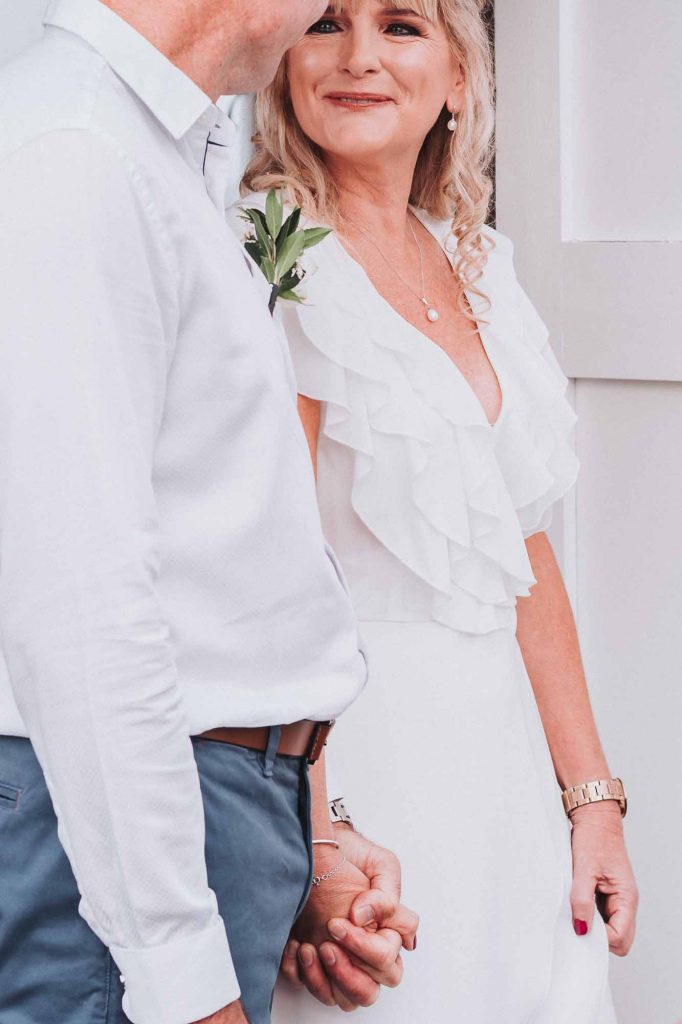 bride and groom at beach hut wedding ceremony