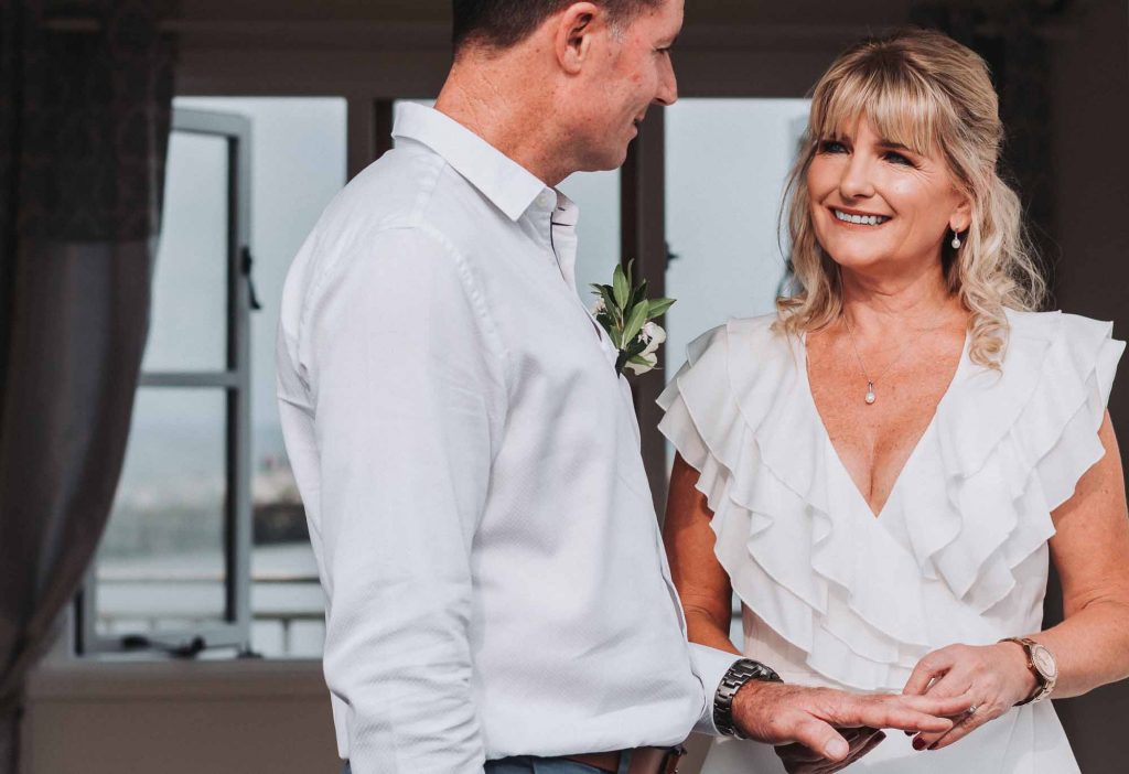 bride and groom at beach hut wedding ceremony