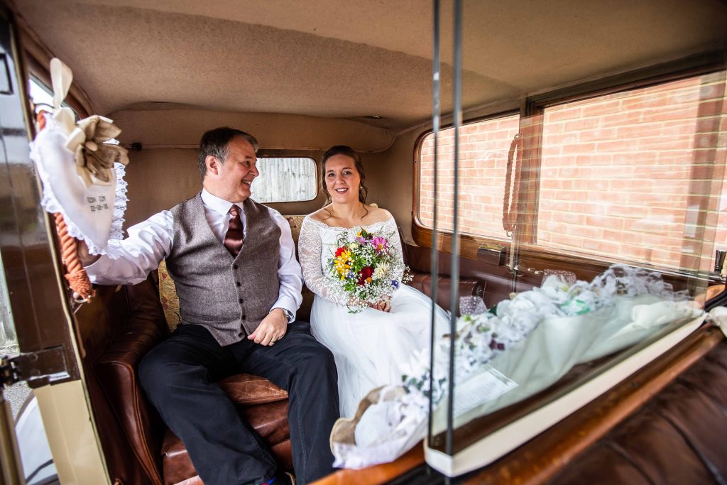 bride and father in wedding car