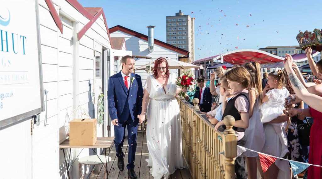 bride and groom confetti exit on herne bay pier