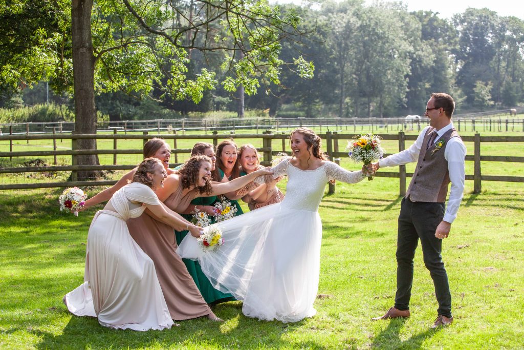 groom with bride and bridesmaids