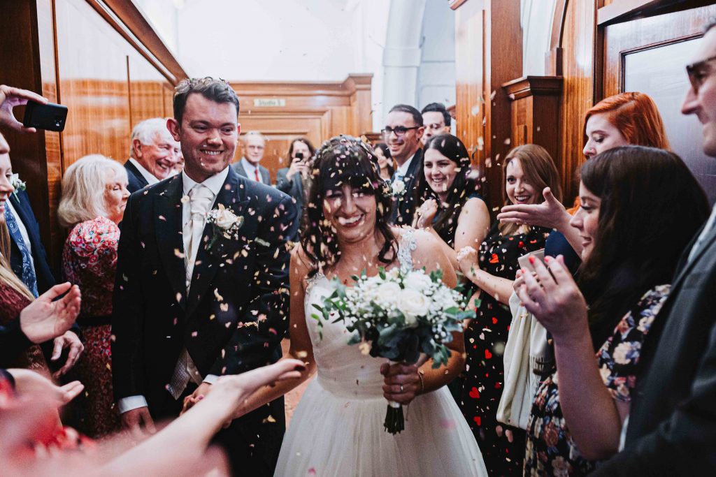 confetti being thrown at Old Finsbury Town Hall wedding