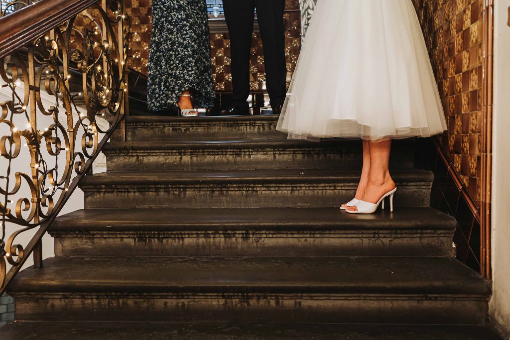 brides wedding shoes standing on steps