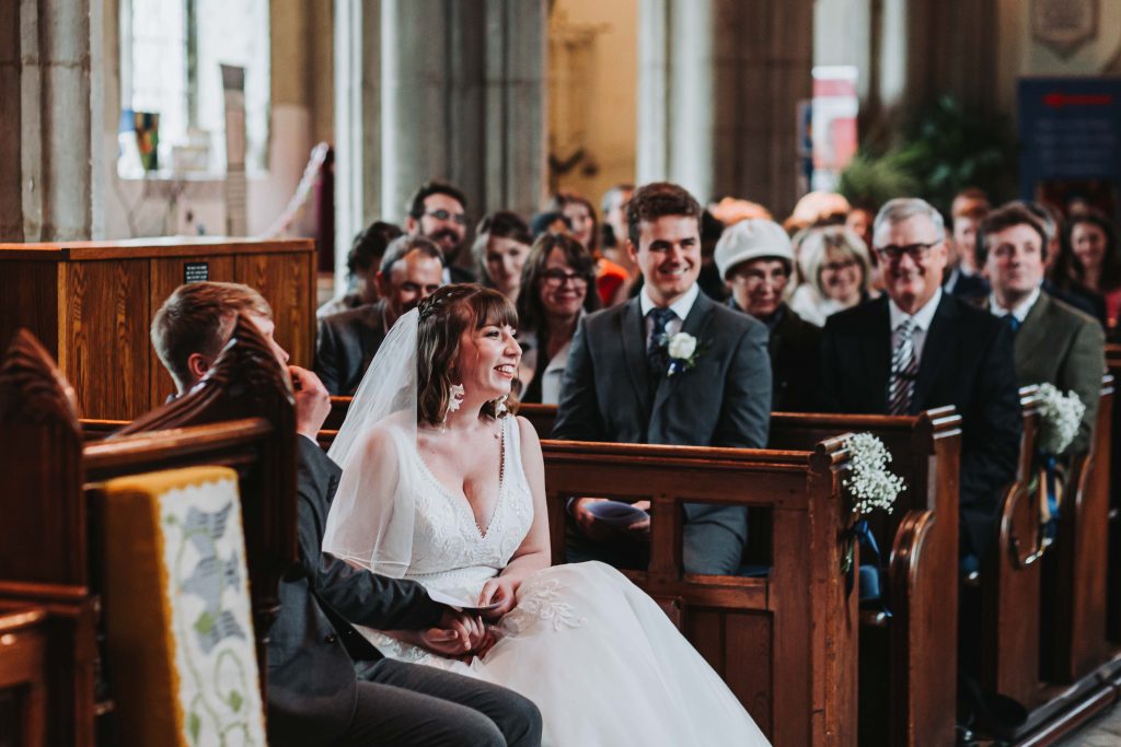 bride laughing in church