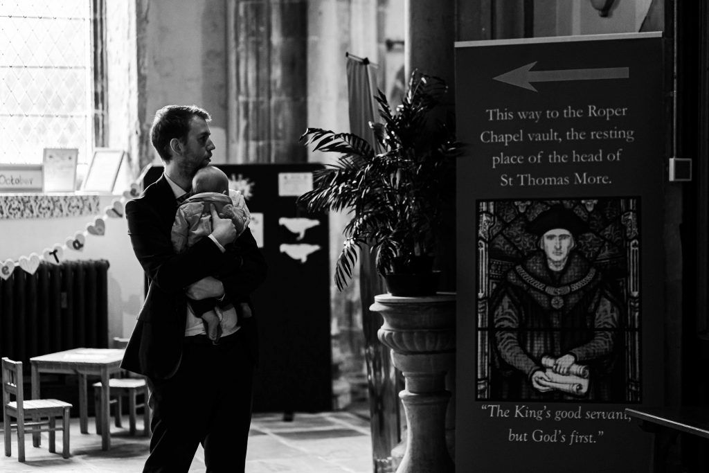 dad and baby at church wedding