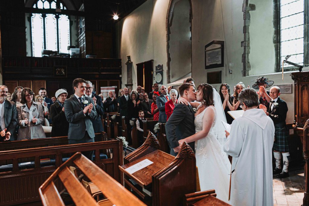 first kiss in church between bride and groom