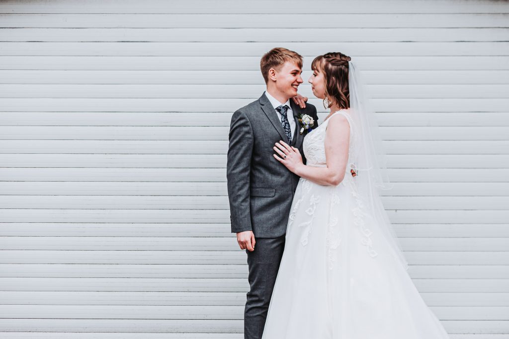 sandwich wedding couple portrait