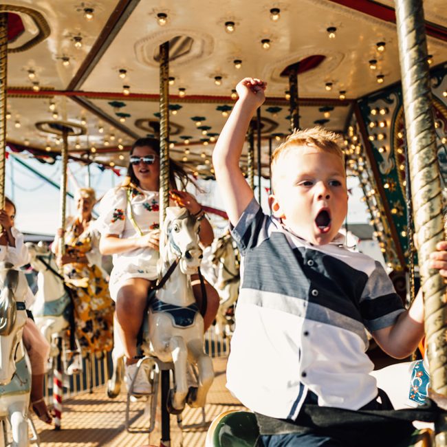 boy on carousel at wedding on herne bay pier