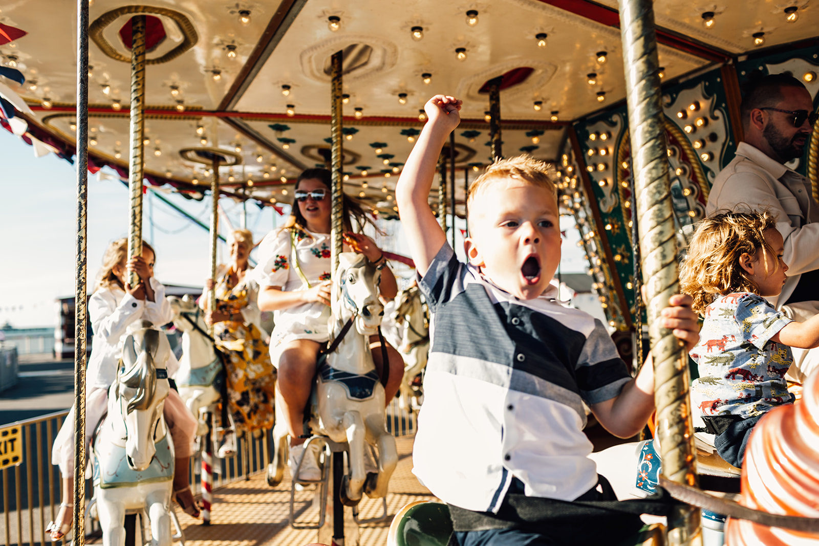 boy on carousel at wedding on herne bay pier