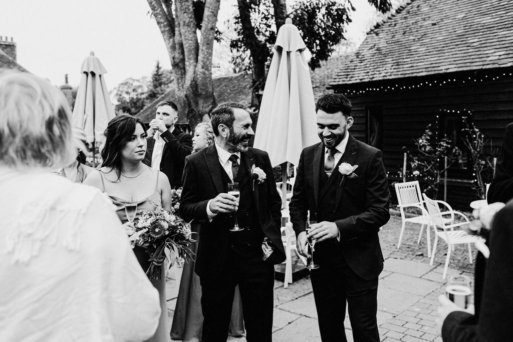 guests laughing together at winters barns wedding venue