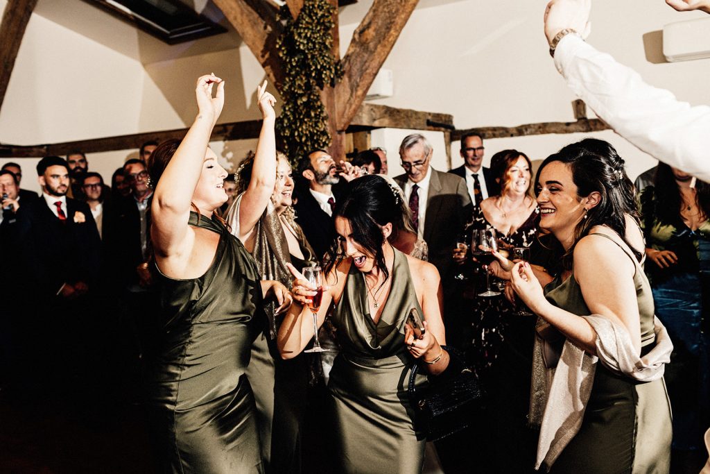 bridesmaids dancing on dancefloor at winters barns wedding venue