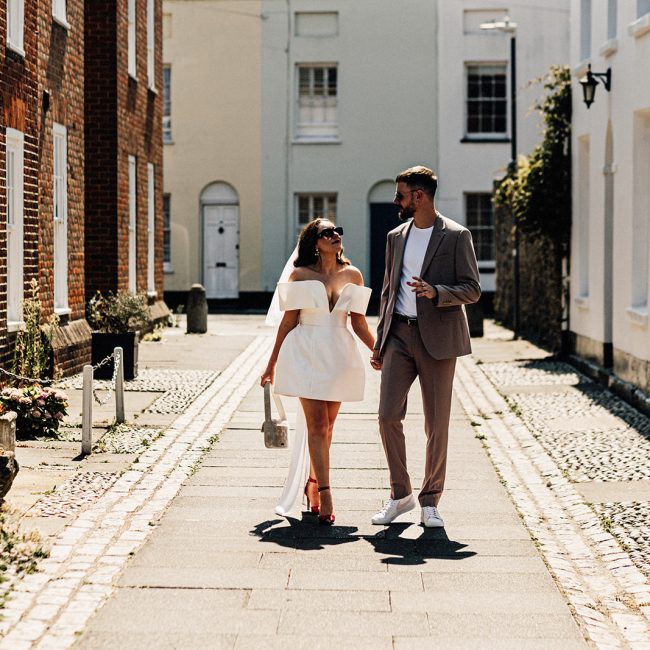 Canterbury Wedding Photographer captures antural portrait of bride and groom on streets of Canterbury