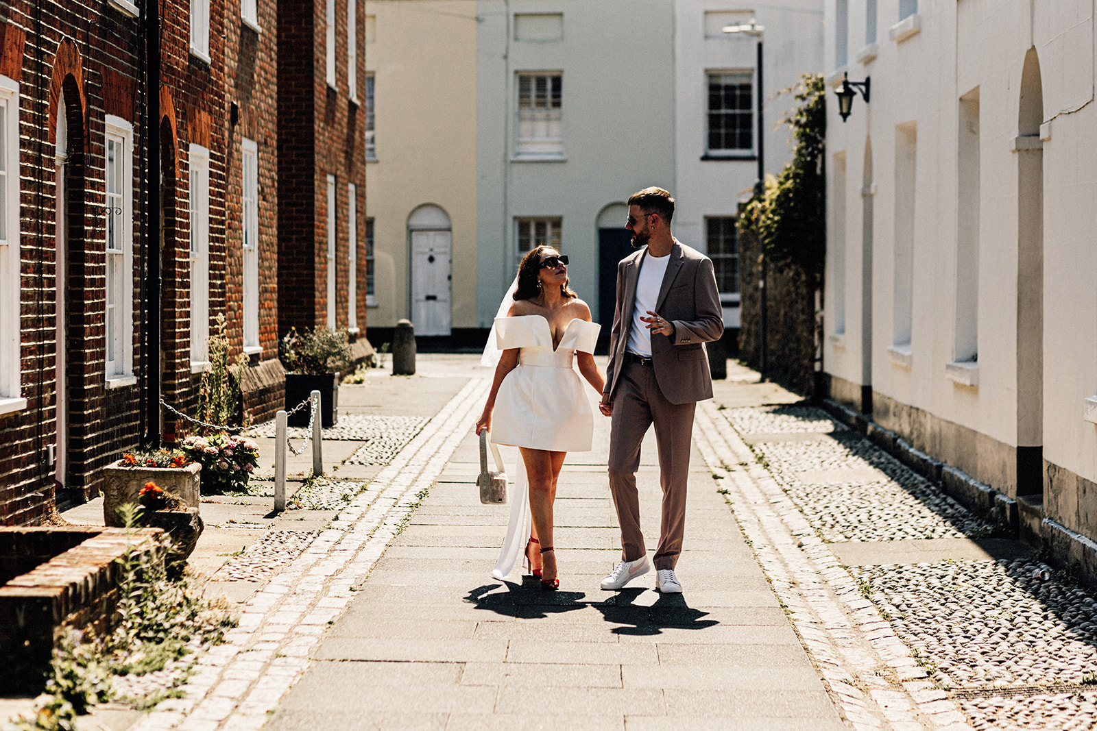 Canterbury Wedding Photographer captures antural portrait of bride and groom on streets of Canterbury