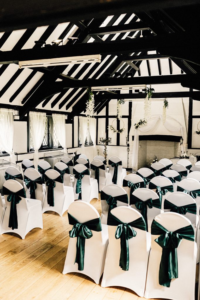 ceremony room at Chilham village Hall decorated in green and white