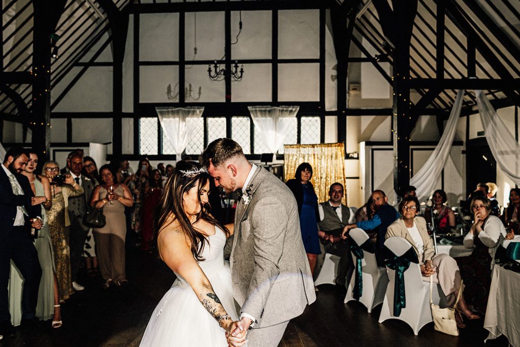 first dance with bride and groom on dance floor by Chilham Village Hall wedding photographer