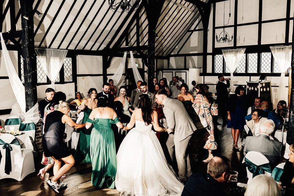 people dancing on dance floor at a wedding