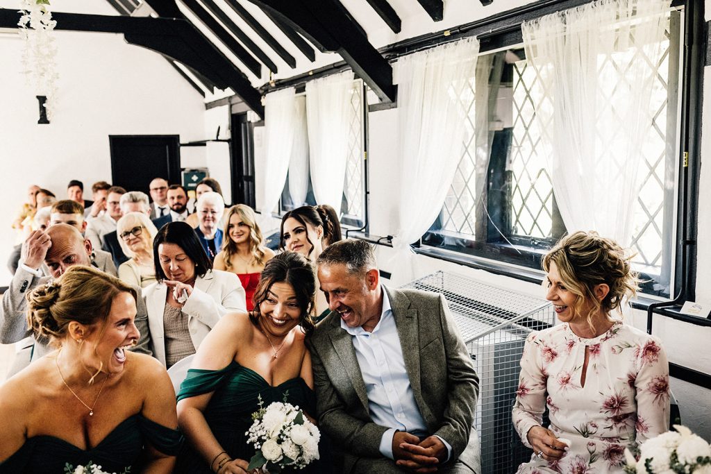 wedding guests laughing