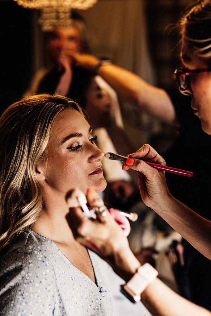 bridal prep with makeup being applied at Guston Court wedding venue