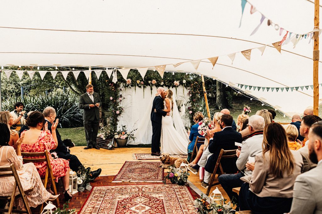 First kiss by bride and groom captured by Guston Court Wedding Photographer