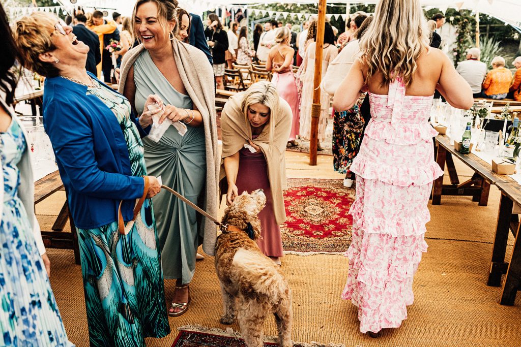 wedding guests laughing in conversation at a Kent wedding venue