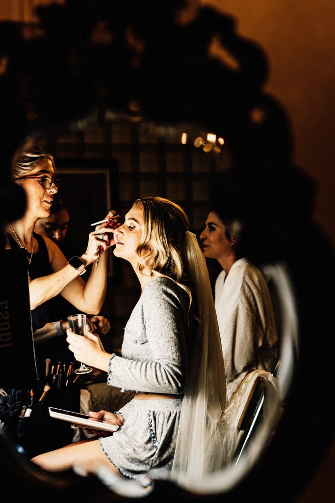 bridal prep with makeup being applied at Guston Court wedding venue