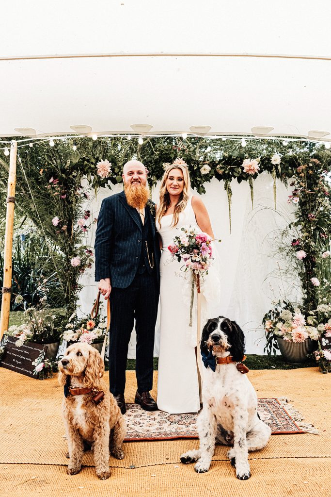 bride and groom posing with their dogs at Guston Court Wedding