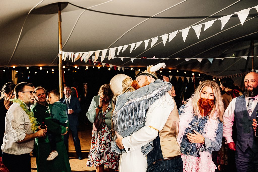 bride and groom kissing on dance floor at a Guston Court Wedding captured by kent wedding photographer