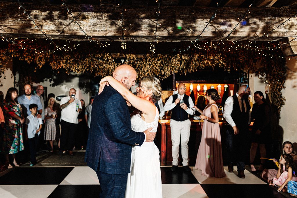 bride and groom on dance floor together
