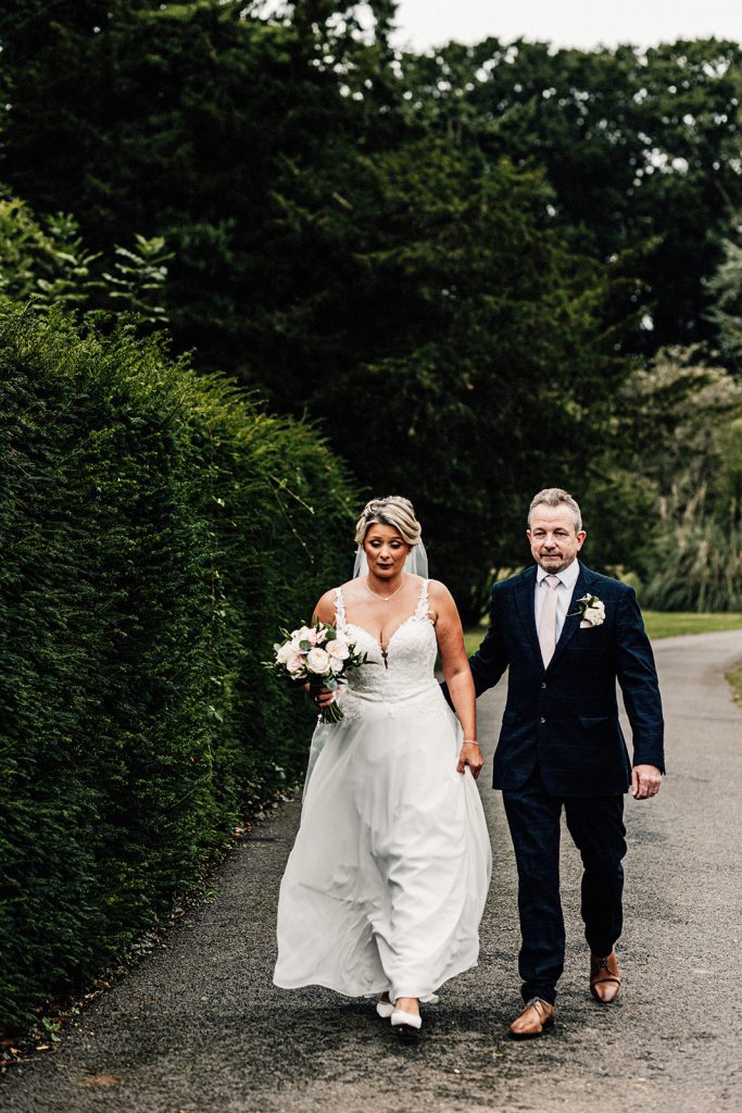 bride and father making their way to ceremony